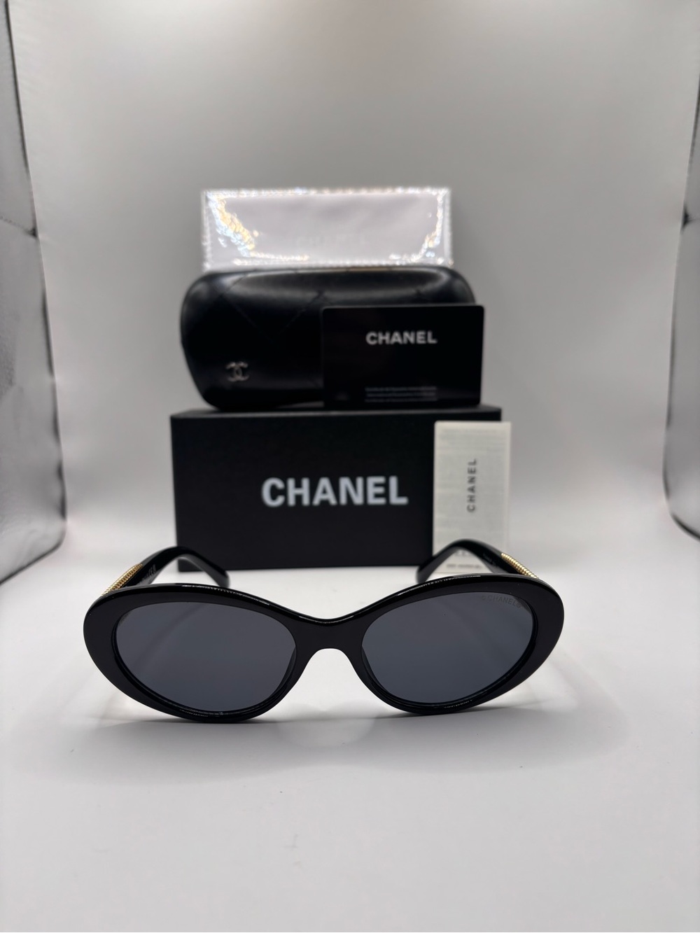 CHANEL Black Cat-Eye Sunglasses with Gold Accents